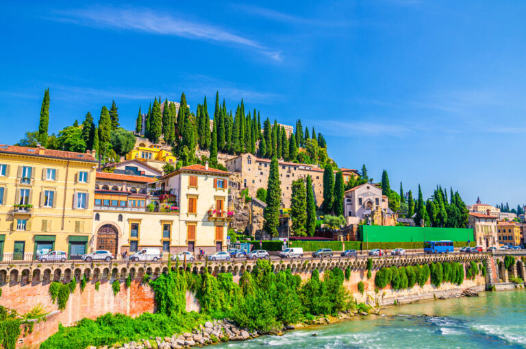 Castel San Pietro St. Peter Castle, Museo Archeologico, Convento di San Girolamo on hill with cypress trees and Adige river in Verona city historical centre, blue sky, Veneto Region, Northern Italy
