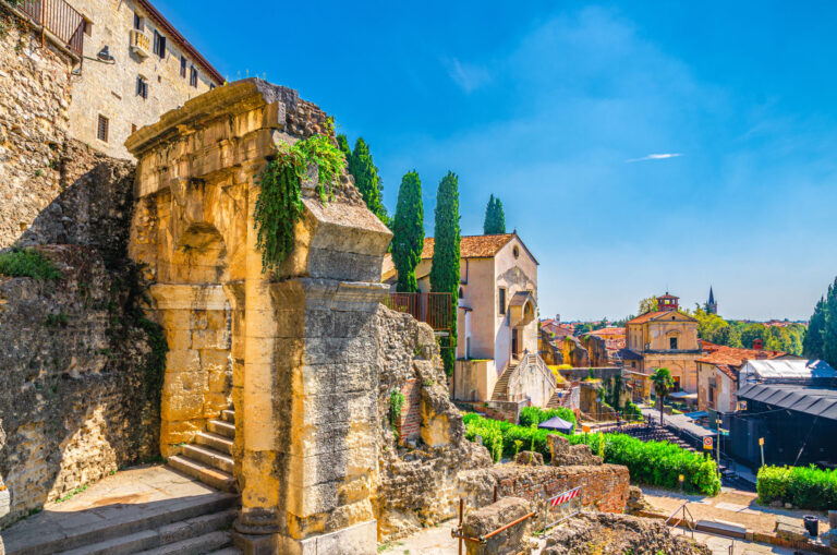 Chiesa dei Santi Siro e Libera catholic church, Roman Theater Archaeological Museum Museo Archeologico with ruins, Piazza del Foro square, Verona city historical centre, blue sky, Veneto Region, Italy