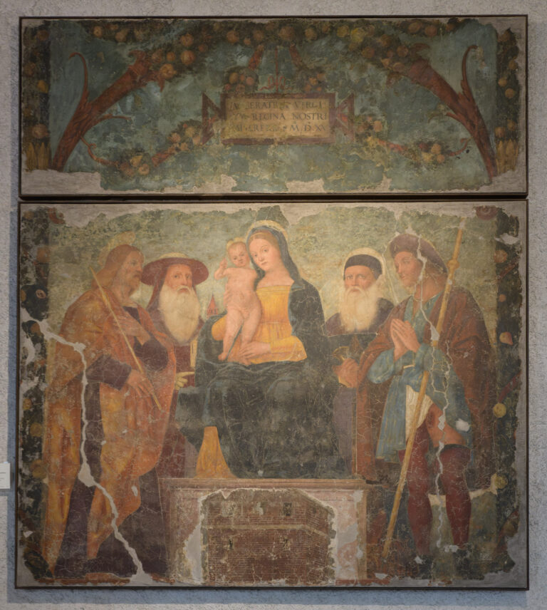 Verona, Italy - April 1, 2025: Madonna and Child with Saints fresco by Francesco Morone at Museo di Castelvecchio.