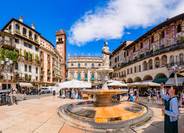 VERONA, ITALY – MAY 10, 2024: Piazza delle Erbe in Verona. This historic square, surrounded by medieval buildings and vibrant markets, is one of the oldest and most iconic public spaces in the city.